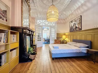 a bedroom with a bed and a chandelier at Bruxelles Midi in Brussels