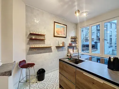 a kitchen with a sink and a window at Bruxelles Midi in Brussels