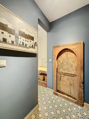 a room with a wooden door and a tile floor at Bruxelles Midi in Brussels