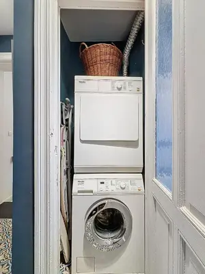 a washer and dryer with a basket on top of it at Bruxelles Midi in Brussels