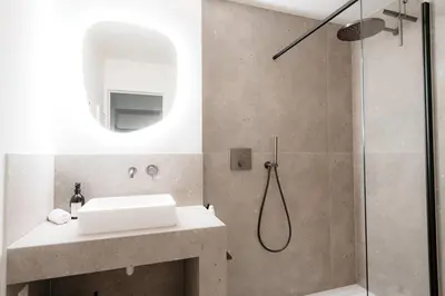 a bathroom with a sink and a shower at Cathedral View luxurious Apartment in Antwerp