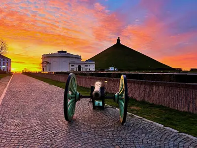 a camera on a brick road with a sunset at Plein centre de Waterloo! 1 in Waterloo