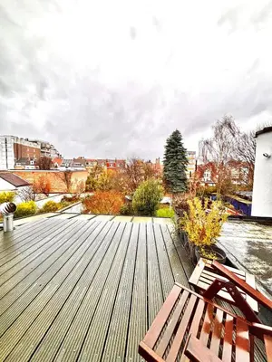 a wooden deck with a bench on top of it at Room in Guest room - Charming Guest Room in Historic Brussels Mansion in Brussels