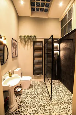 a bathroom with a sink and a toilet at Maison d'hôtes de Xavier in Brussels