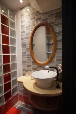 a bathroom with a sink and a mirror at BrusselsHomes in Brussels