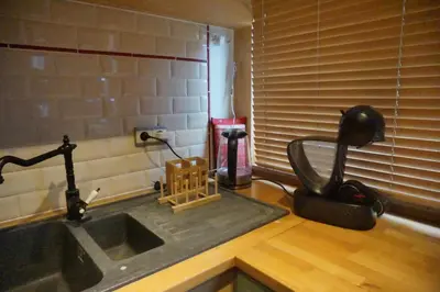 a kitchen with a sink and a faucet at BrusselsHomes in Brussels