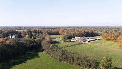 an aerial view of a house in the middle of a field at Luxe accomodatie d'einde in Beerse