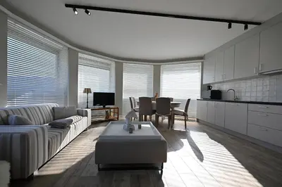 a living room with a couch and a table at Luxe accomodatie d'einde in Beerse