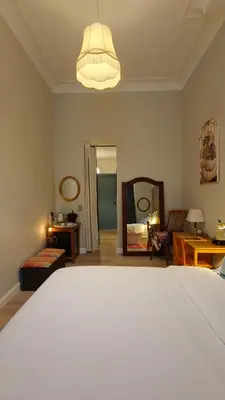 a bedroom with a bed and a living room at Marilou and Dalibor's room in Brussels