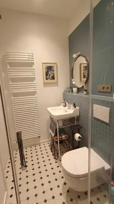a bathroom with a sink and a toilet and a mirror at Marilou and Dalibor's room in Brussels
