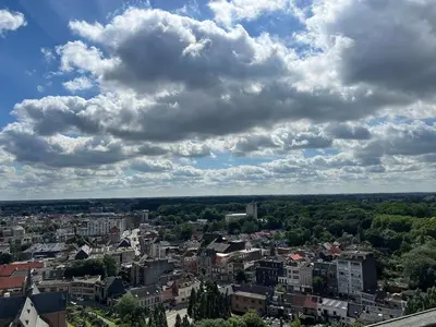 a view of a city under a cloudy sky at Jacuzzi & free parking at Andries Place in Antwerp