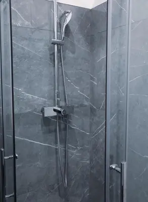 a shower with a glass door in a bathroom at YabaMuandaz Apparts de Standing & Confort in Brussels