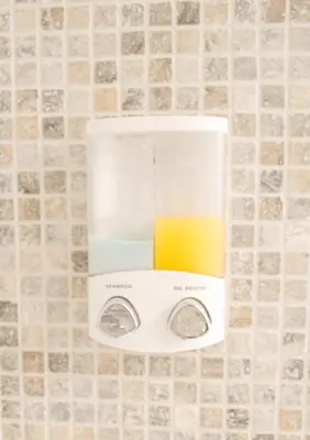 a soap dispenser on a wall in a bathroom at 1BR apt métro Hopital Erasme Bordet handicapt friendly in Brussels