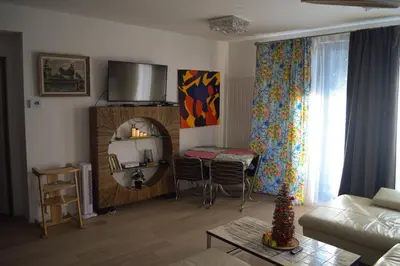 a living room with a couch and a table at 1BR apt métro Hopital Erasme Bordet handicapt friendly in Brussels