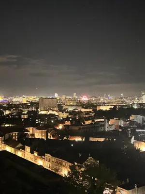 a view of a city at night with lights at Air Bey Penthouse in Brussels