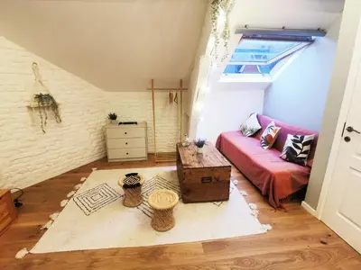 a living room with a couch and a table at Dodo Guest House in Brussels