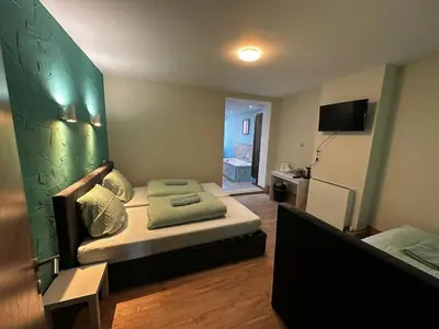 a small bedroom with a bed in a room at Antwerp SportPlaza in Antwerp