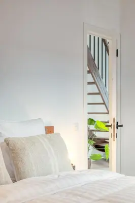 a bedroom with a bed and a staircase at 2-BR Getaway with MAS view in Antwerp