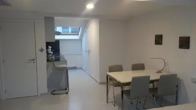 a dining room with a table and chairs at Aparthotel Midi Residence in Brussels
