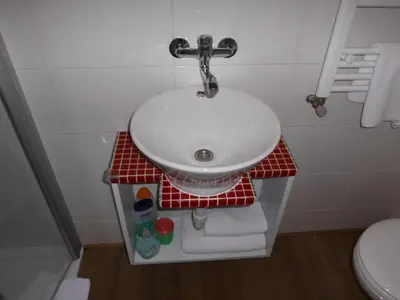 a bathroom with a sink and a toilet at Aparthotel Midi Residence in Brussels