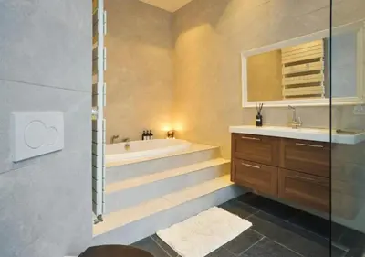 a bathroom with a shower and a tub and a sink at 2BR apartment at new Zuidpark in Antwerp