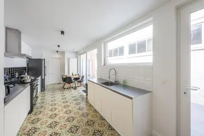 a kitchen with a sink and a counter at Temse city center in Temse