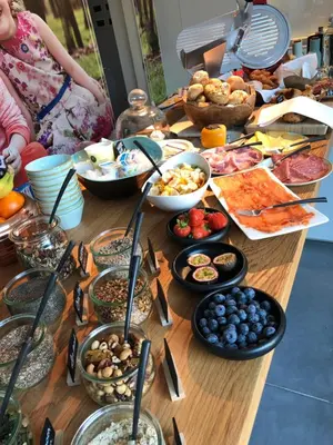 a table with a bunch of food on it at B&B Ceder10 in Kruibeke