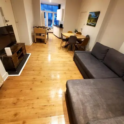 a living room with a couch and a table at Nice Flat Grand Place in Brussels