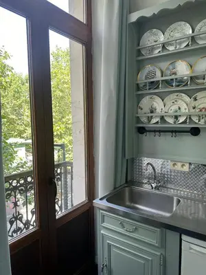 a kitchen with a sink and a window at Happy Home in Brussels