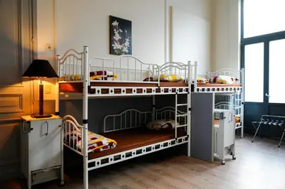 two sets of bunk beds in a room at YOUR HOSTEL midi station in Brussels
