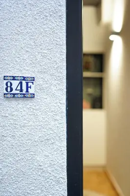a sign on the side of a wall at Charming home by Grote Markt with Free Parking in Antwerp
