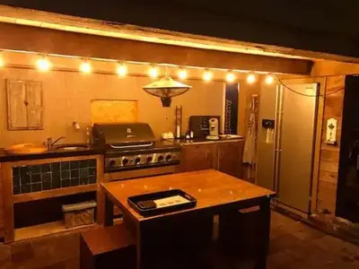a kitchen with a stove and a refrigerator with lights at Memories in Assenede