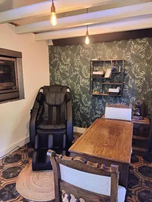 a meeting room with a table and chairs at Memories in Assenede