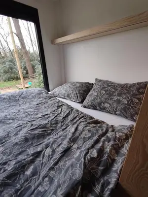 a bed in a room with a window at Kromven Puur Genieten in Merksplas