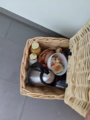a basket with eggs and other food in it at Kromven Puur Genieten in Merksplas