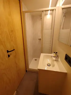 a bathroom with a sink and a shower at Kromven Puur Genieten in Merksplas