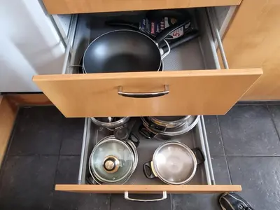 a drawer in a kitchen with pots and pans at Appartement Ruggeveld in Antwerp