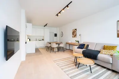 a living room with a couch and a table at Modern 6-Guest Apartment in Central Antwerp in Antwerp
