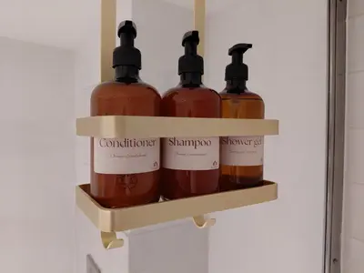 four bottles of wine on a shelf in a refrigerator at Begijnhofpoort B&B in Turnhout