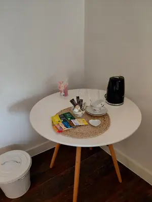 a white table with a coffee maker on top of it at Begijnhofpoort B&B in Turnhout