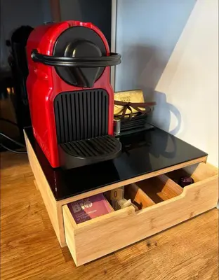 a red toaster sitting on top of a table at Charmant appartement in Antwerpen Zuid met zicht op de stroom in Antwerp