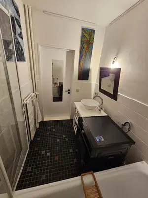 a bathroom with a sink and a shower and a tub at Studio El - Cozy Bright Flat in the Green Corner of Antwerp in Antwerp