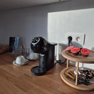 a coffee maker sitting on a table with food at Orient Herent - Boetiekhotel in Herent