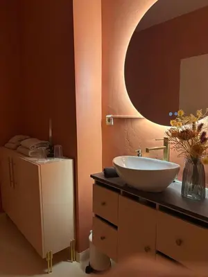 a bathroom with a sink and a mirror on a counter at Your Haven of Peace! in Brussels