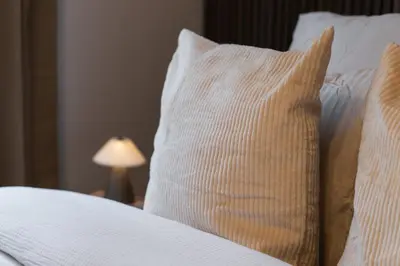a close up of a bed with a pillow on it at 3 Stylish Studios at a Great Location in Gent in Ghent