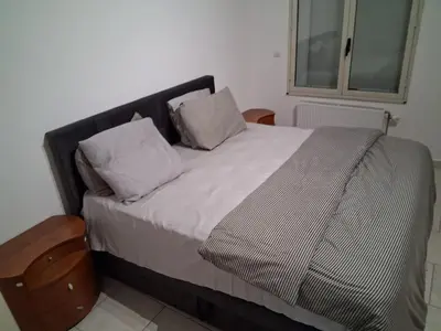 a bed with two pillows on it in a room at Bruxelles IN in Brussels