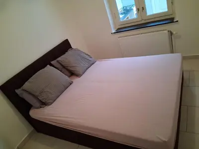 a bed in a room with two pillows on it at Bruxelles IN in Brussels