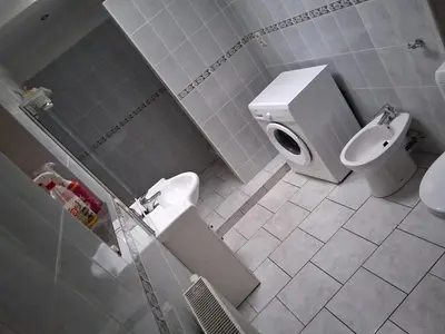 a bathroom with a toilet and a sink at Bruxelles IN in Brussels