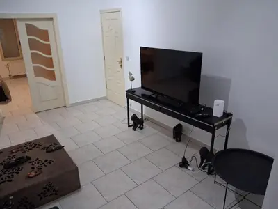 a living room with a flat screen tv on a table at Bruxelles IN in Brussels