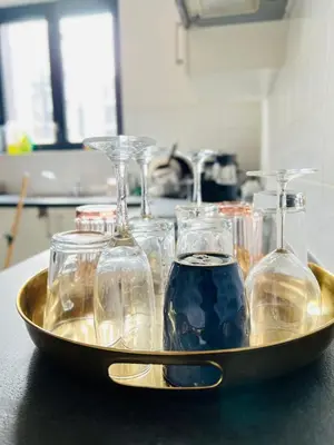 a tray filled with wine glasses on a counter at Brussels City Chambers in Brussels
